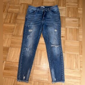 Kancan mid rise distressed jeans.
